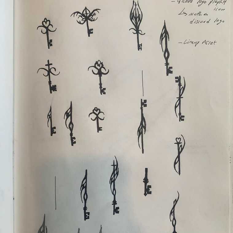 Handwritten sketchbook page of ornate key designs